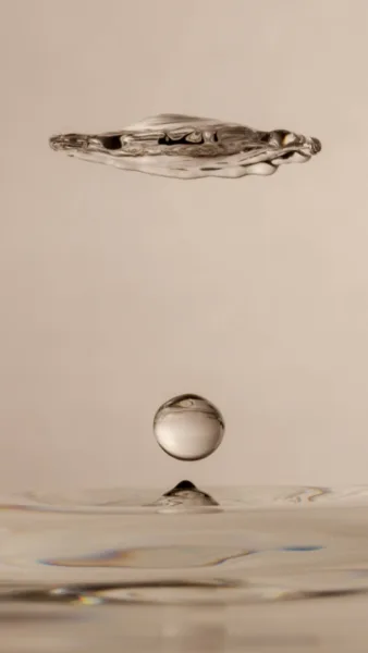 A drop of water falling into the water