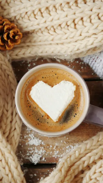 Coffee with cream on a wooden table iPhone wallpaper