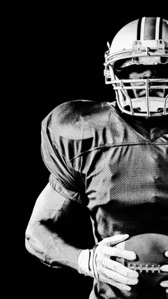 Black and white photo of football player