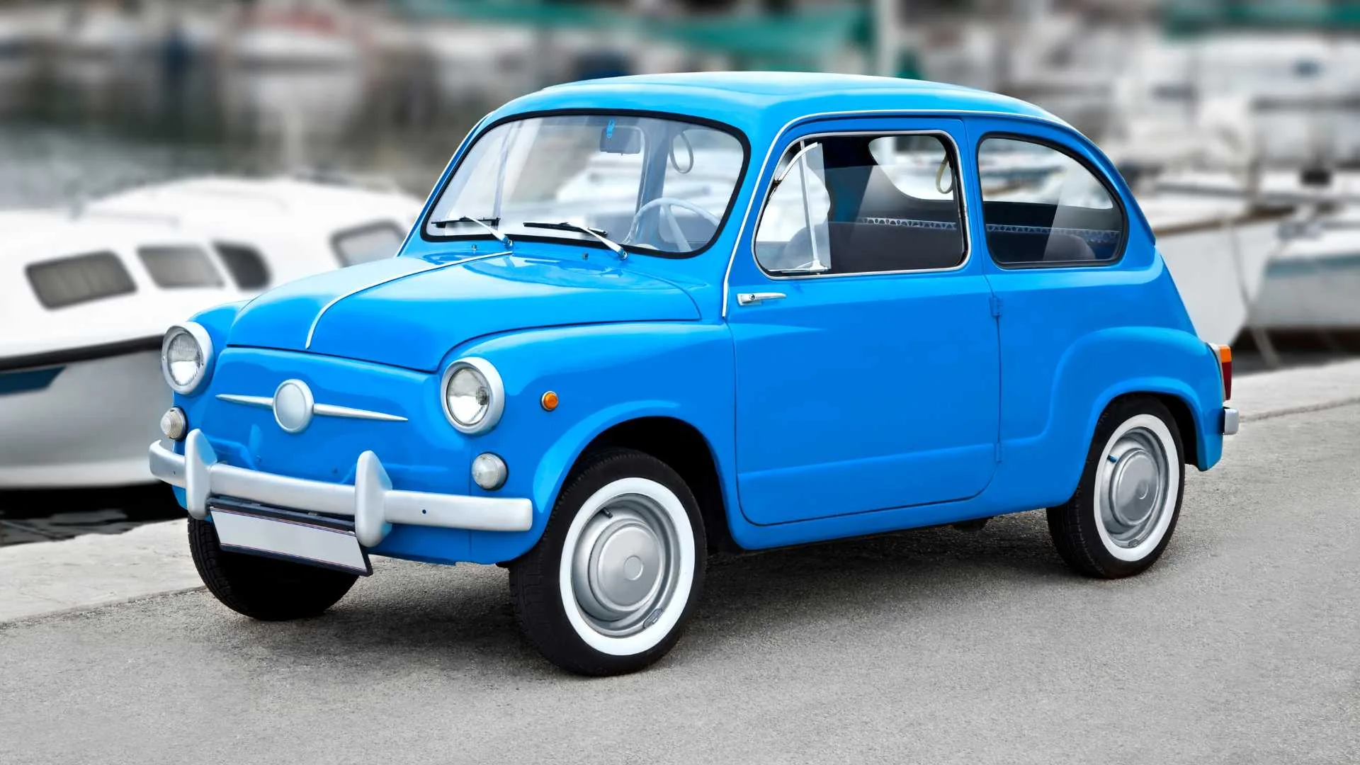 Blue vintage car parked on the road